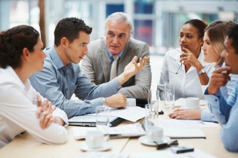 Business people at a table talking